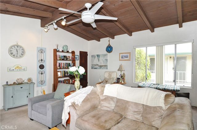 a large bedroom with a large bed and a large window