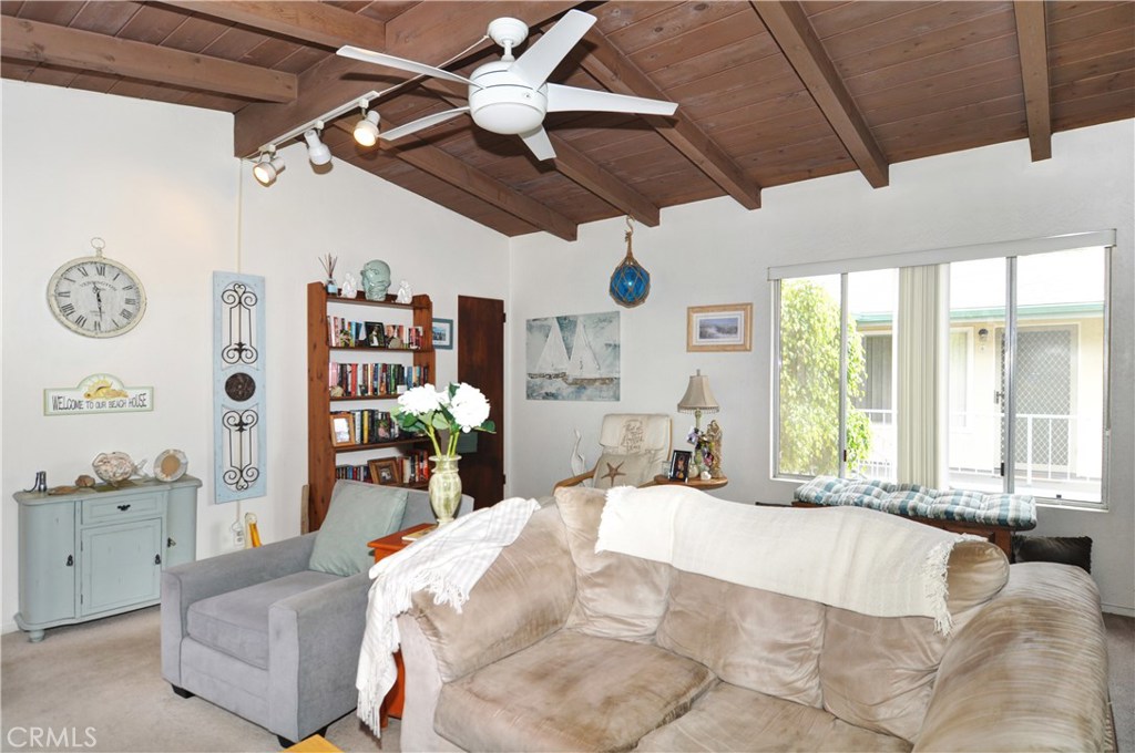 217 10th Street, Unit 4 Seal Beach, CA 90740 - Photo 28 of 45 a large bedroom with a large bed and a large window