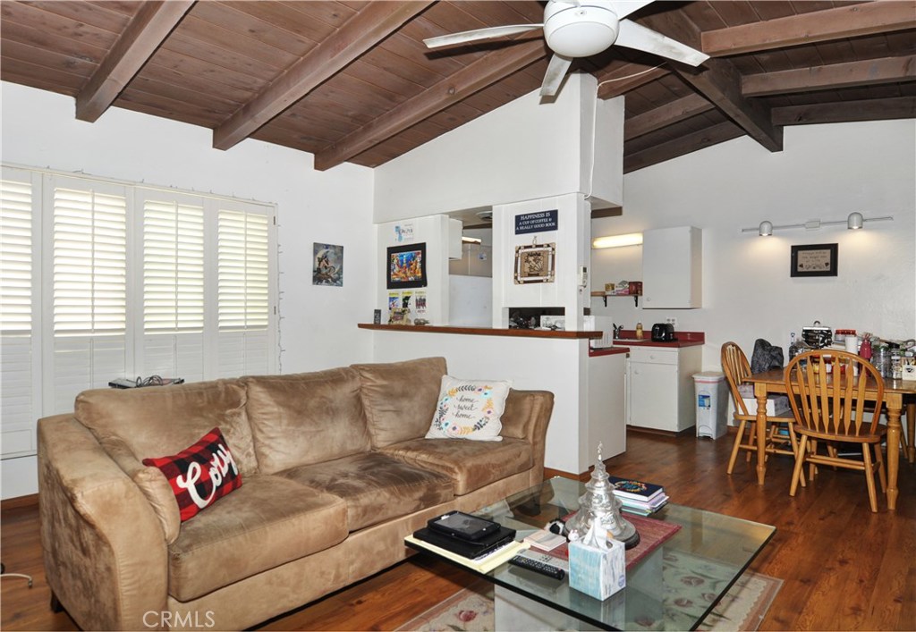 217 10th Street, Unit 4 Seal Beach, CA 90740 - Photo 36 of 45 a living room with furniture and wooden floor