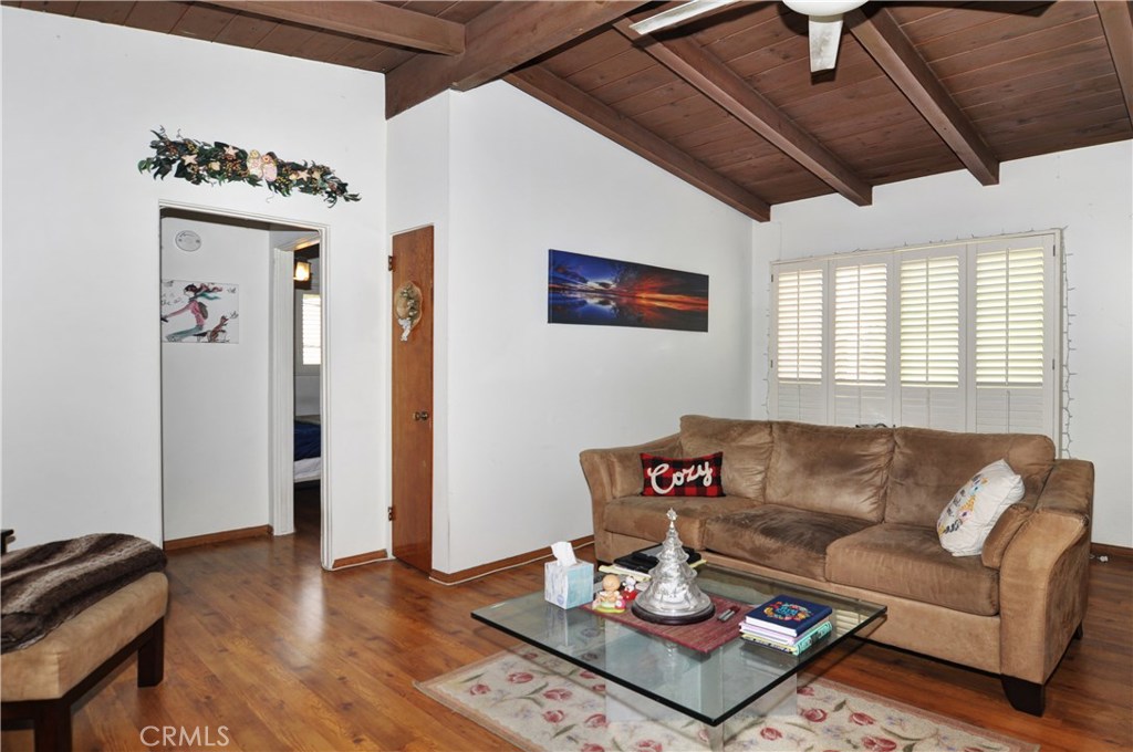 217 10th Street, Unit 4 Seal Beach, CA 90740 - Photo 37 of 45 a living room with furniture and wooden floor