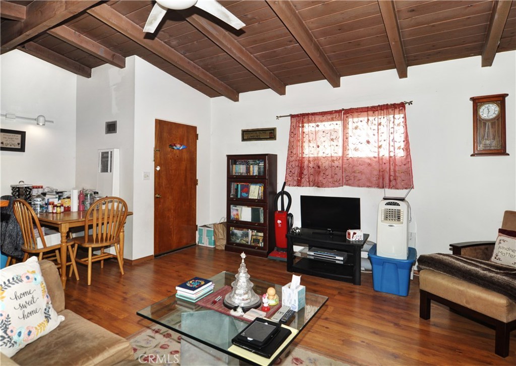 217 10th Street, Unit 4 Seal Beach, CA 90740 - Photo 38 of 45 a living room with furniture and a flat screen tv