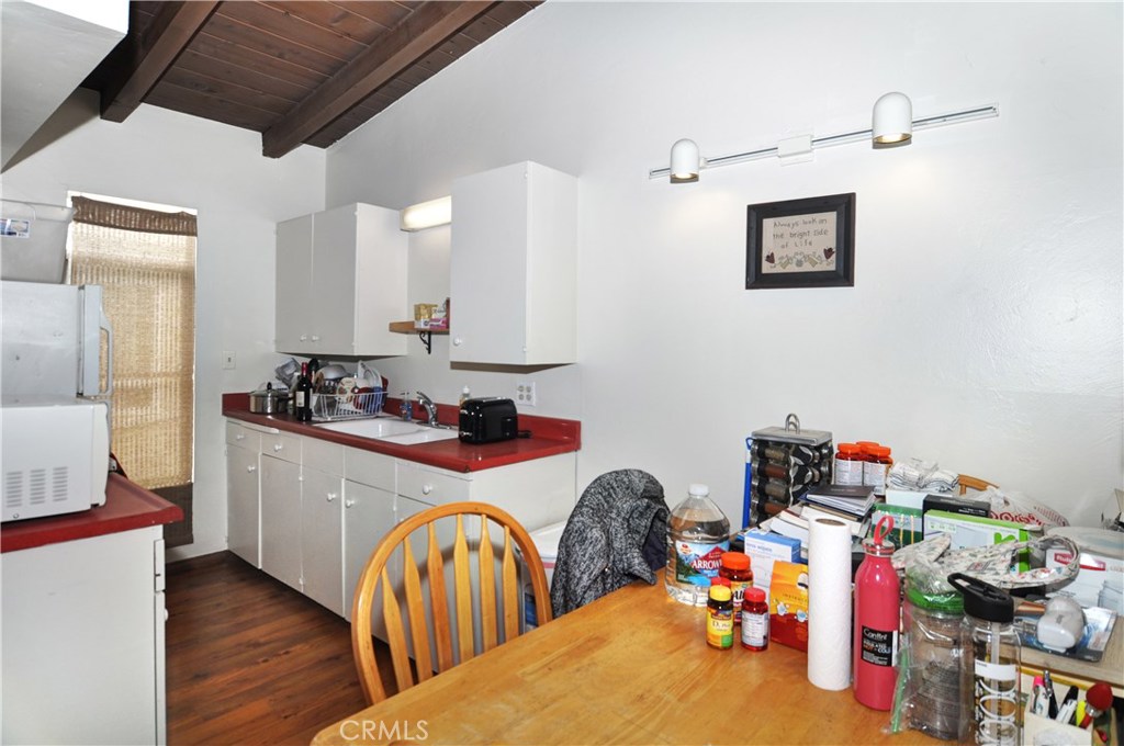 217 10th Street, Unit 4 Seal Beach, CA 90740 - Photo 39 of 45 a very nice looking room with a dining table chairs
