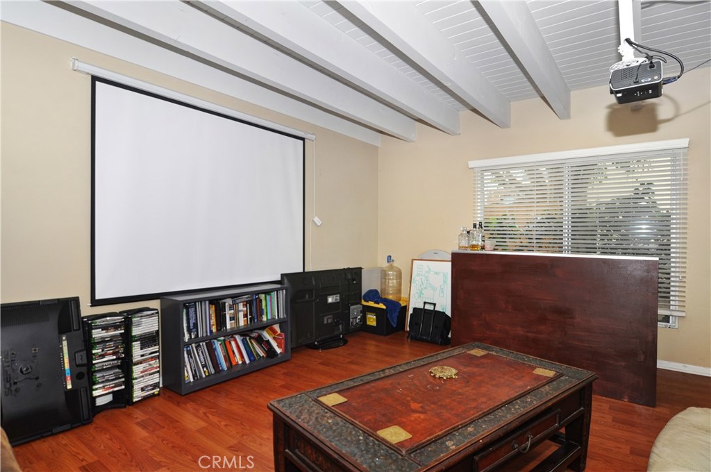 217 10th Street, Unit 4 Seal Beach, CA 90740 - Photo 4 of 45 a living room with furniture pool table and a window