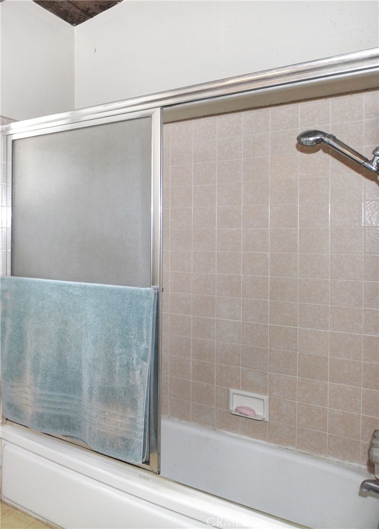 217 10th Street, Unit 4 Seal Beach, CA 90740 - Photo 41 of 45 a bathroom with a shower and a bathtub