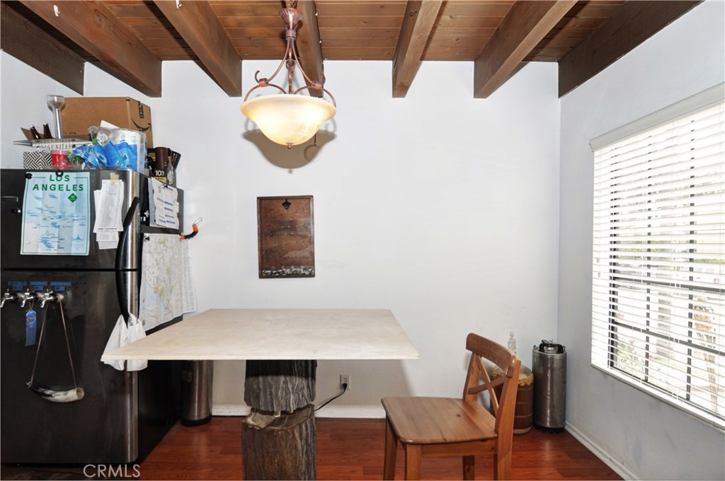217 10th Street, Unit 4 Seal Beach, CA 90740 - Photo 10 of 45 a view of a dining room with furniture and wooden floor