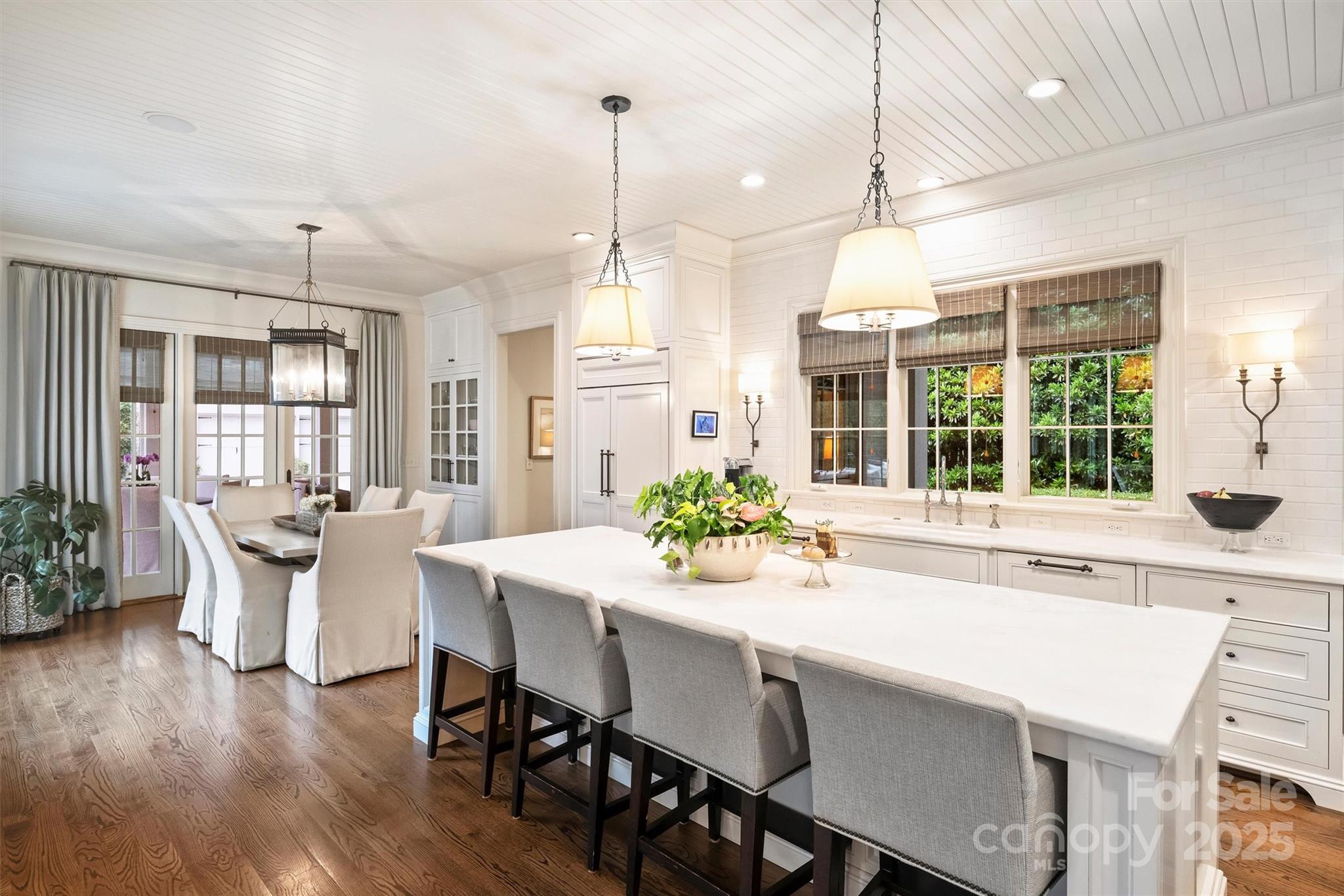 3950 Abingdon Road Charlotte, NC 28211 - Photo 13 of 43 a kitchen with a table chairs and wooden floor
