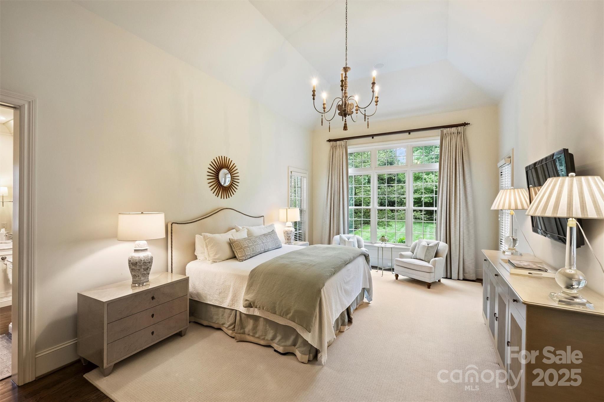 3950 Abingdon Road Charlotte, NC 28211 - Photo 16 of 43 a bed room with a bed and a chandelier