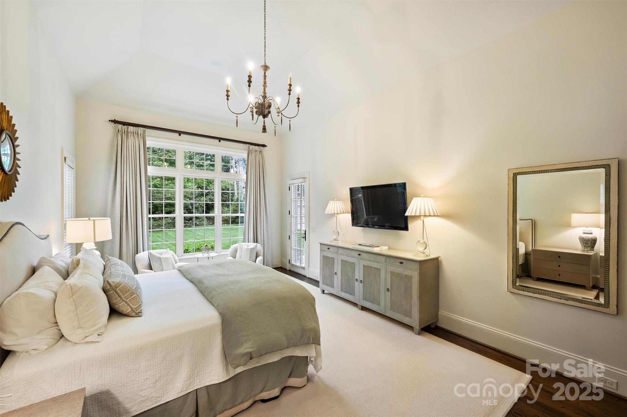 3950 Abingdon Road Charlotte, NC 28211 - Photo 17 of 43 a bedroom with a bed and a television