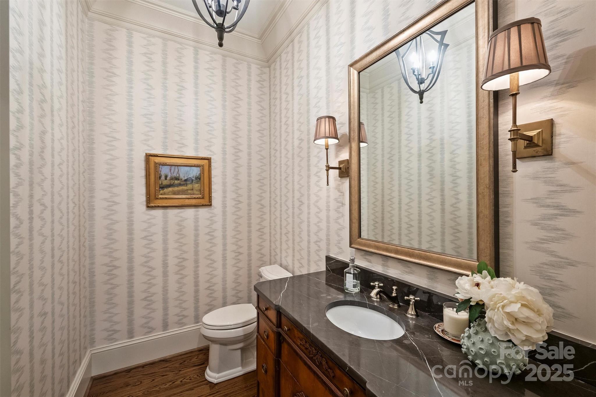 3950 Abingdon Road Charlotte, NC 28211 - Photo 25 of 43 a bathroom with a granite countertop sink a toilet and a mirror