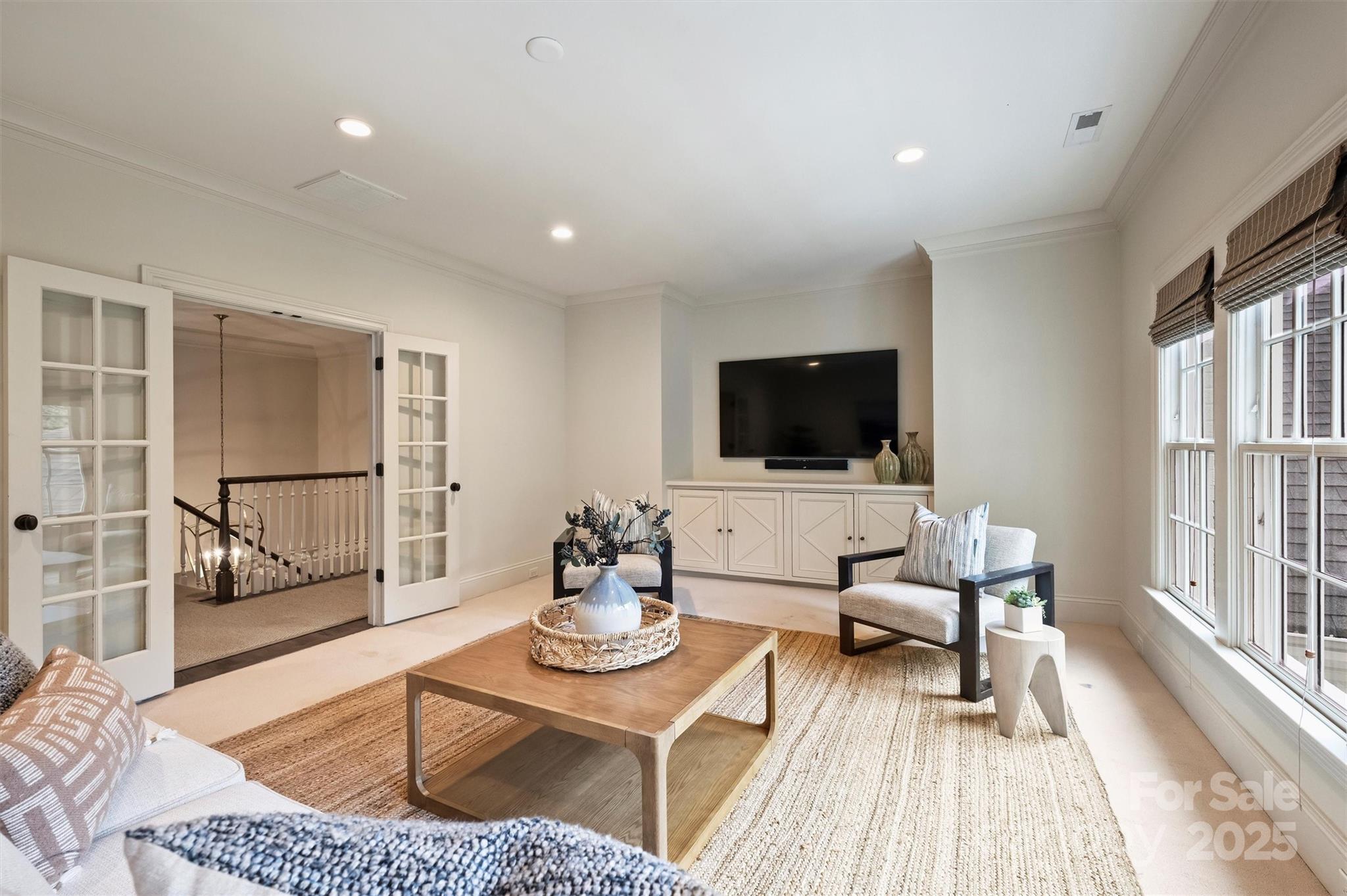 3950 Abingdon Road Charlotte, NC 28211 - Photo 27 of 43 a living room with furniture and a flat screen tv