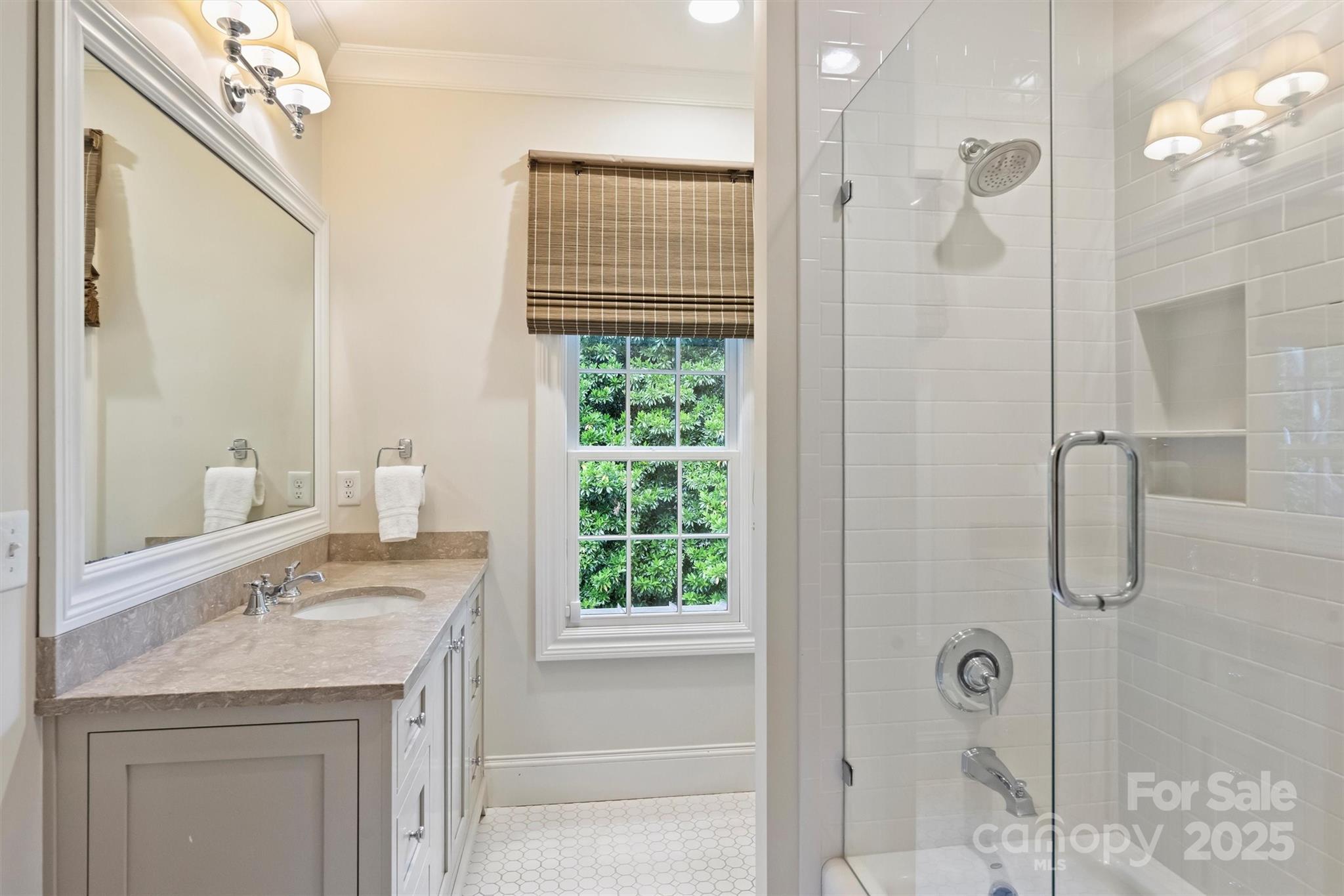 3950 Abingdon Road Charlotte, NC 28211 - Photo 33 of 43 a bathroom with a granite countertop sink a mirror and shower