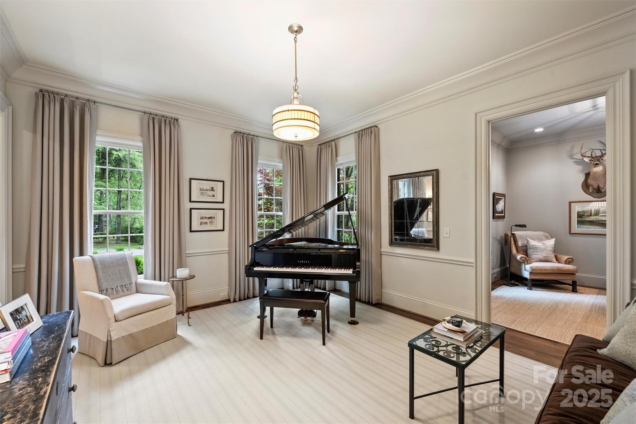 3950 Abingdon Road Charlotte, NC 28211 - Photo 5 of 43 a living room with furniture a piano and a chandelier