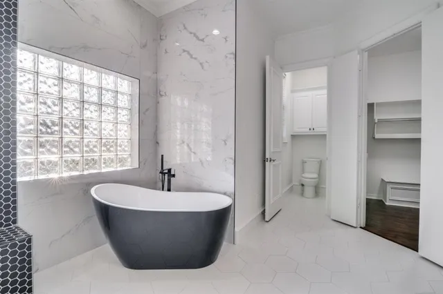 a bathroom with a bathtub and a sink