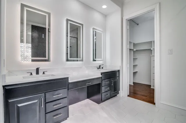 a kitchen with a sink and cabinets