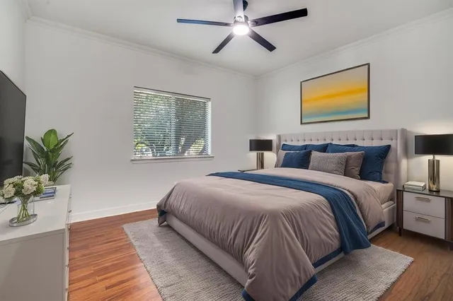 a bedroom with bed and a window