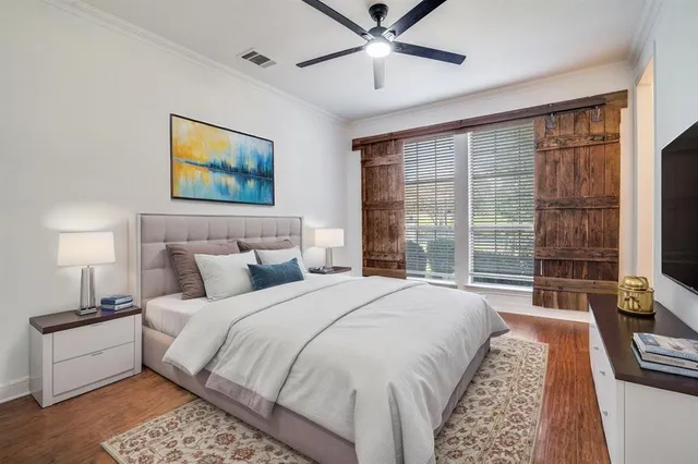 a spacious bedroom with a large bed and a window