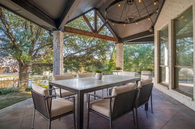 a view of a patio in a backyard