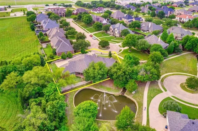 an aerial view of house with yard