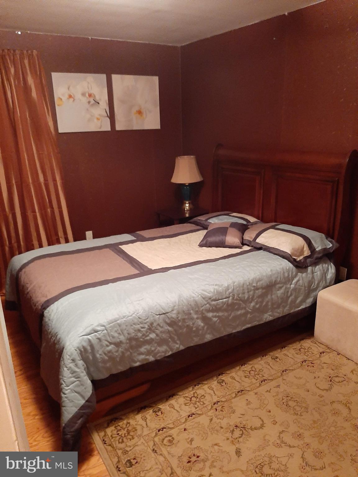 1907 Nester Street Philadelphia, PA 19115 - Photo 11 of 16 a bedroom with a bed and wall painting