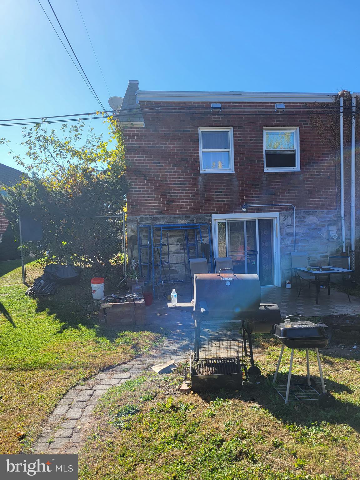 1907 Nester Street Philadelphia, PA 19115 - Photo 16 of 16 a backyard of a house with yard fire pit and outdoor seating