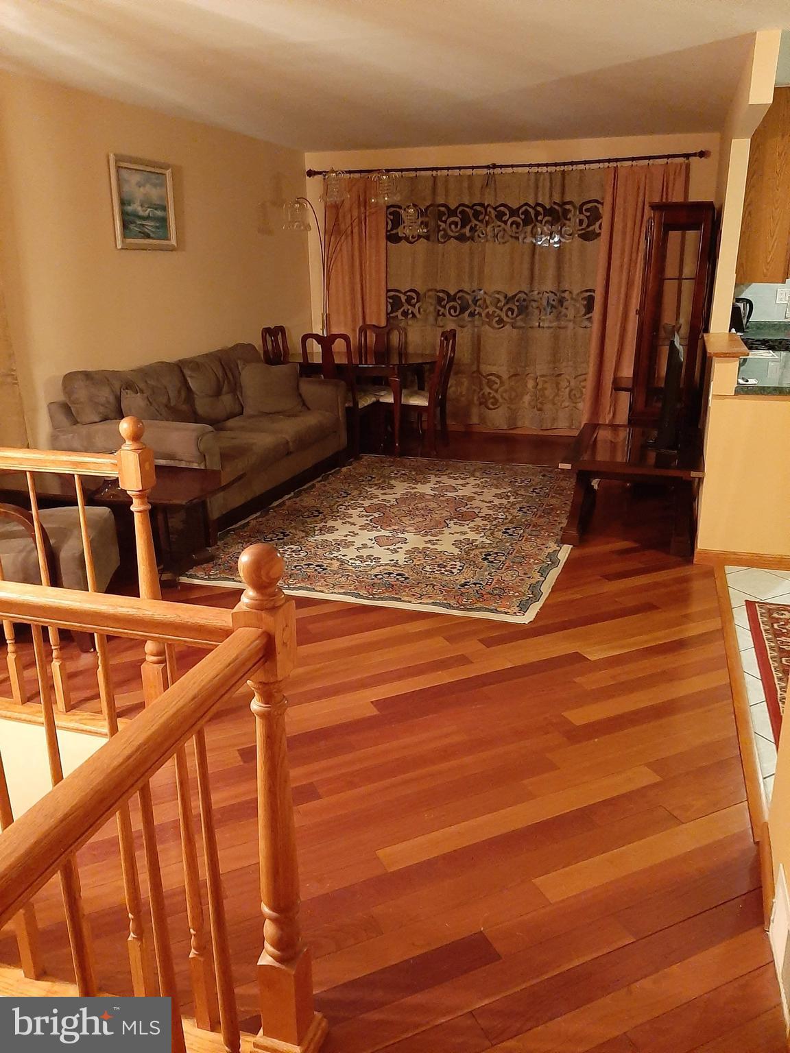 1907 Nester Street Philadelphia, PA 19115 - Photo 7 of 16 a view of a living room with furniture and a floor to ceiling window