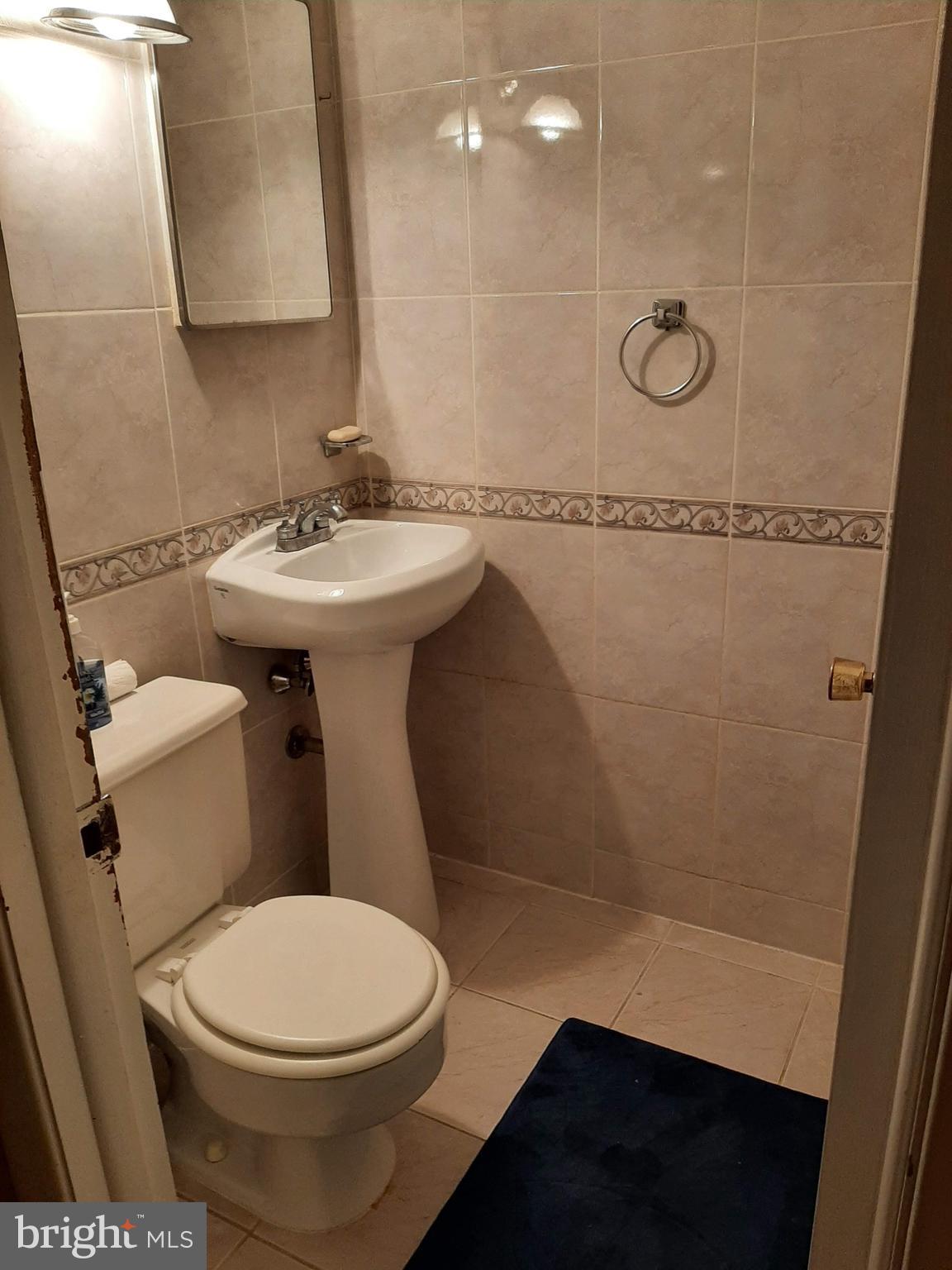 1907 Nester Street Philadelphia, PA 19115 - Photo 9 of 16 a bathroom with a sink a toilet and shower