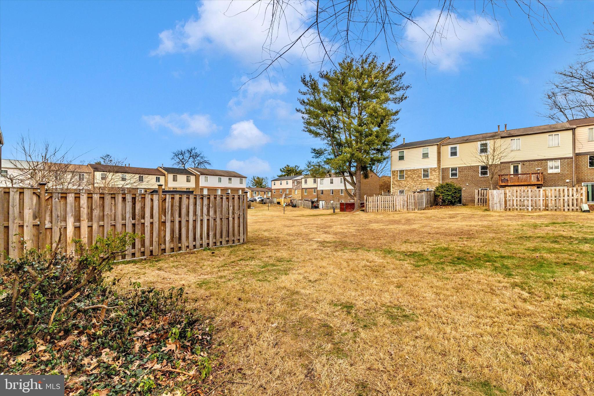 758 West Side Drive, Unit 7G Gaithersburg, MD 20878 - Photo 15 of 16 a view of a yard with wooden fence