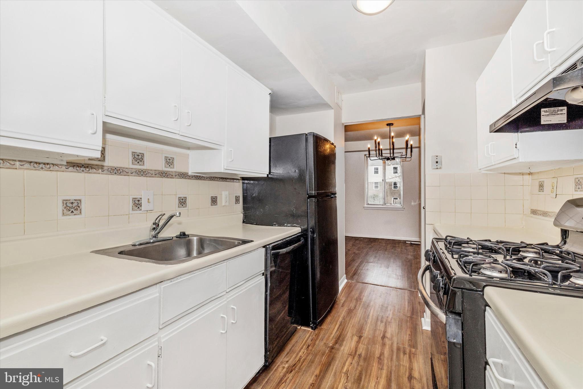 758 West Side Drive, Unit 7G Gaithersburg, MD 20878 - Photo 2 of 16 a kitchen with stainless steel appliances granite countertop a sink stove and refrigerator