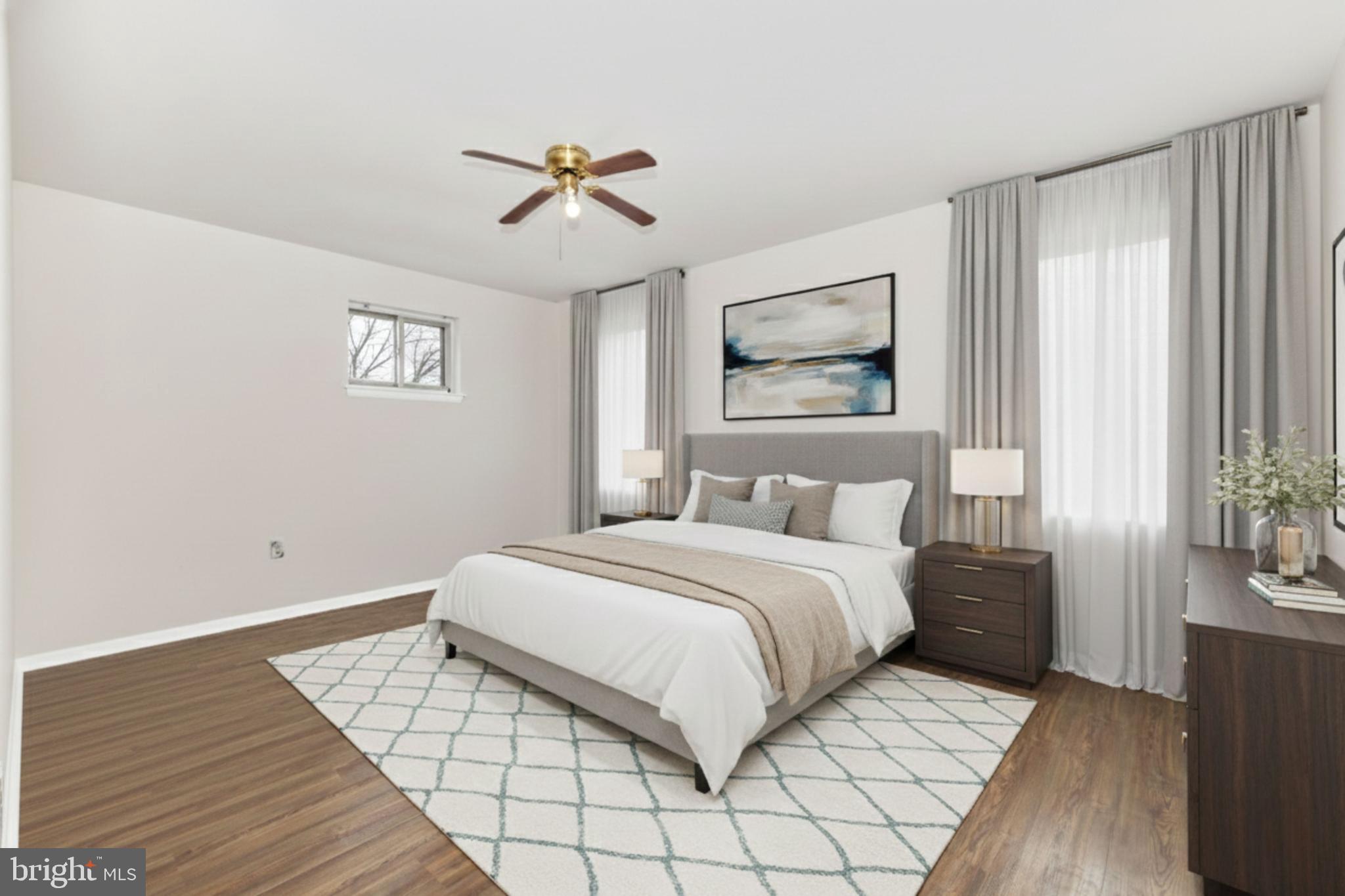 758 West Side Drive, Unit 7G Gaithersburg, MD 20878 - Photo 6 of 16 a bedroom with a large bed and a chandelier