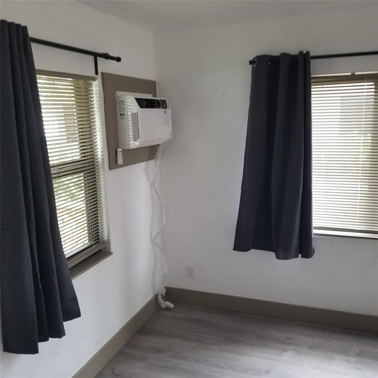 803 Northeast 8th Street Hallandale Beach, FL 33009 - Photo 12 of 38 view of room with window and mirror