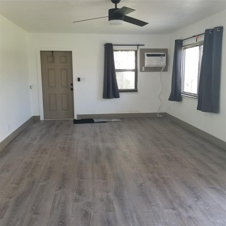 803 Northeast 8th Street Hallandale Beach, FL 33009 - Photo 18 of 38 an empty room with windows and closet