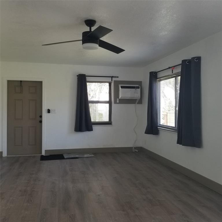 803 Northeast 8th Street Hallandale Beach, FL 33009 - Photo 19 of 38 an empty room with windows