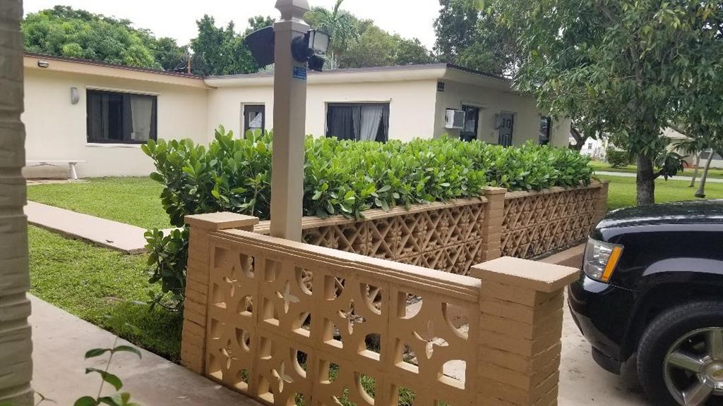 803 Northeast 8th Street Hallandale Beach, FL 33009 - Photo 4 of 38 a view of a house with backyard and sitting area