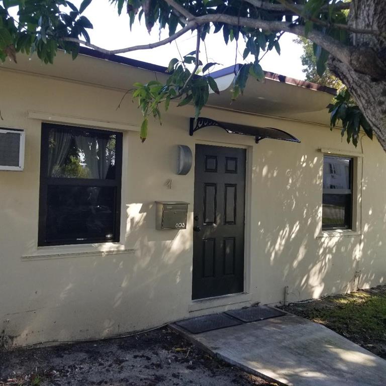 803 Northeast 8th Street Hallandale Beach, FL 33009 - Photo 10 of 38 a view of a entryway door of the house