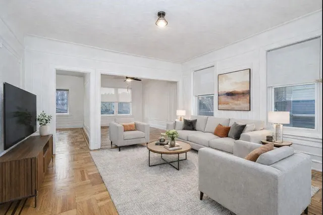 a view of a hallway with wooden walls and stairs