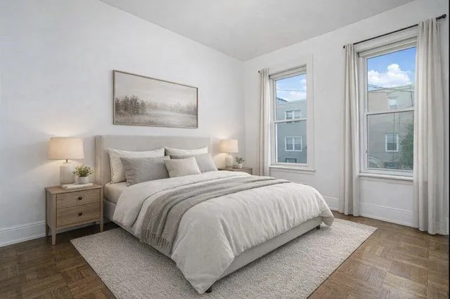 a bedroom with a bed and a table