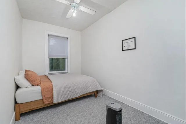 a bathroom with a toilet and a bathtub