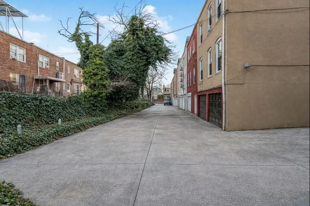 a view of a street with brick building in front of it