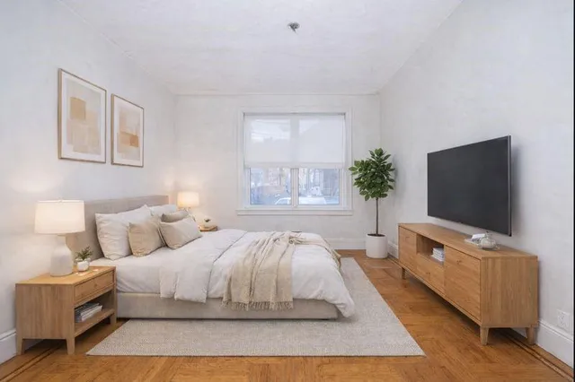 a work room with furniture and a wooden floor