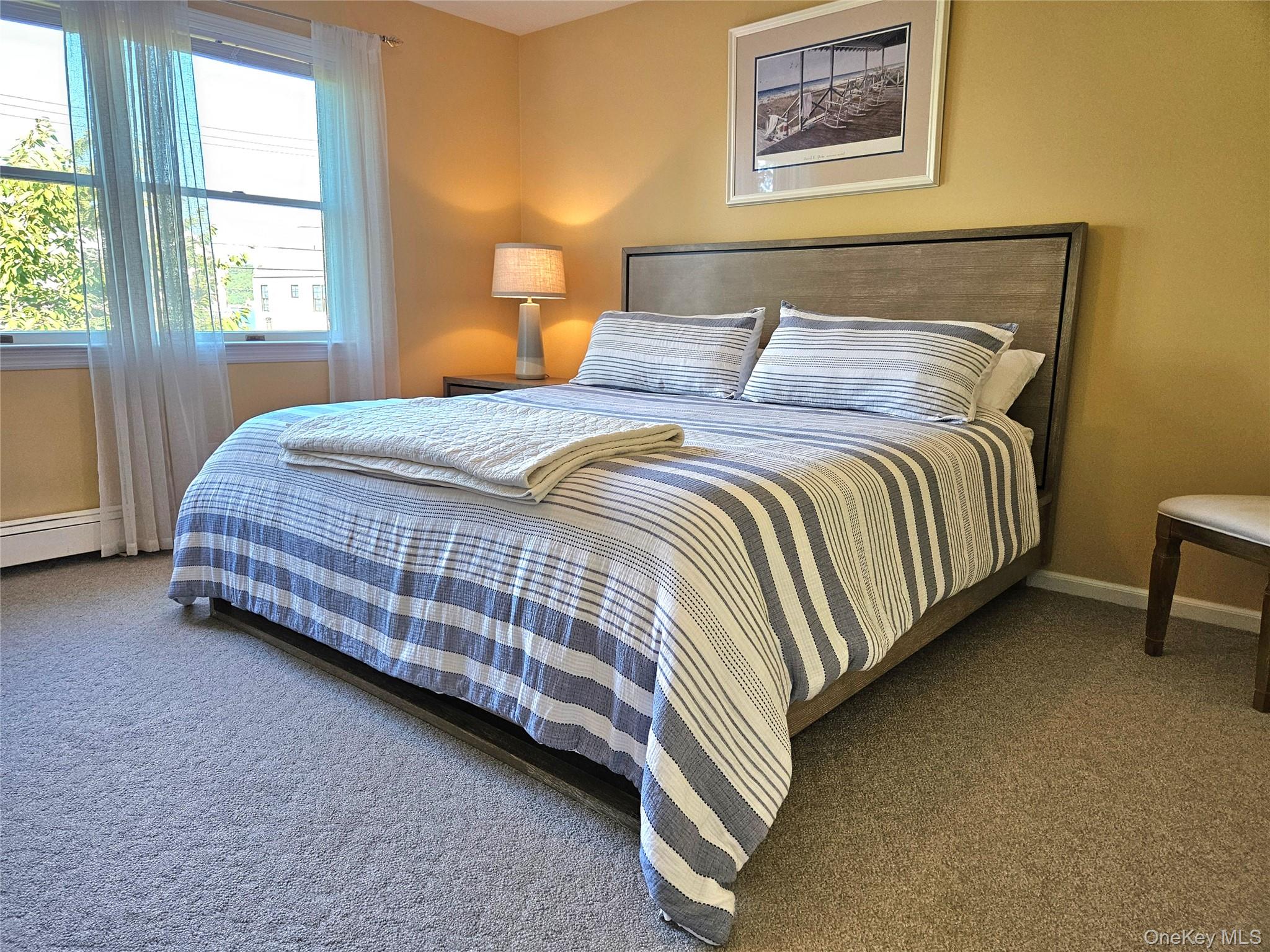 3650 Bay Shore Road Greenport, NY 11944 - Photo 23 of 30 a bedroom with bed and a window