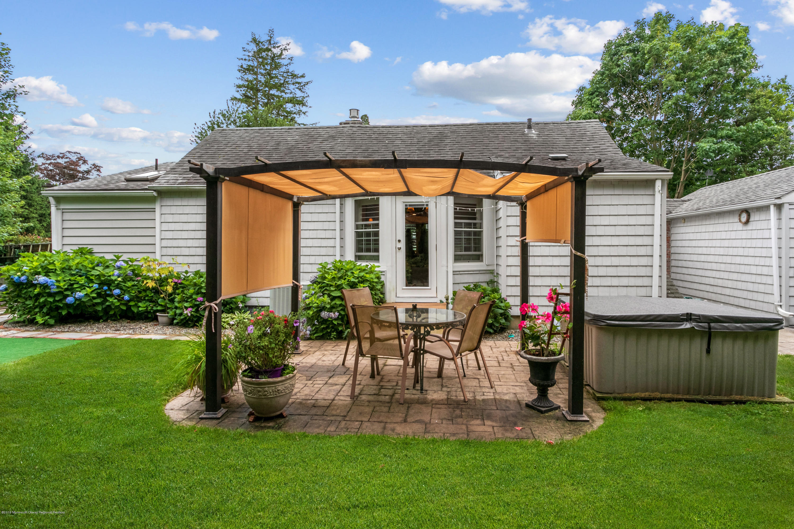 606 Locust Road Brielle, NJ 08730 - Photo 24 of 28 walk out to covered patio