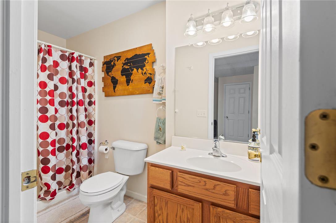 2617 Rising Sun Road Slatington, PA 18080 - Photo 38 of 58 Warm wood cabinetry and an integrated solid surface sink anchor this practical bathroom design.