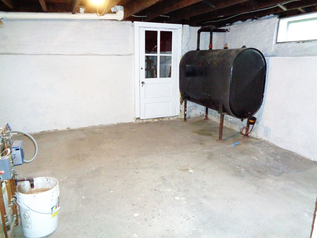 76 Stony Hill Road Wilbraham, MA 01095 - Photo 18 of 22 a living room with furniture and a toilet