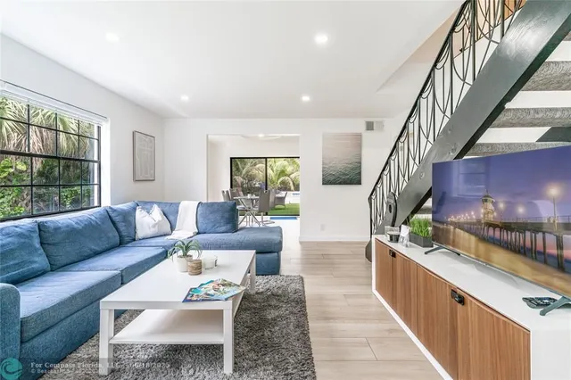 a living room with furniture and window