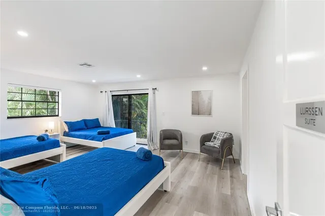 a view of a house with pool and chairs