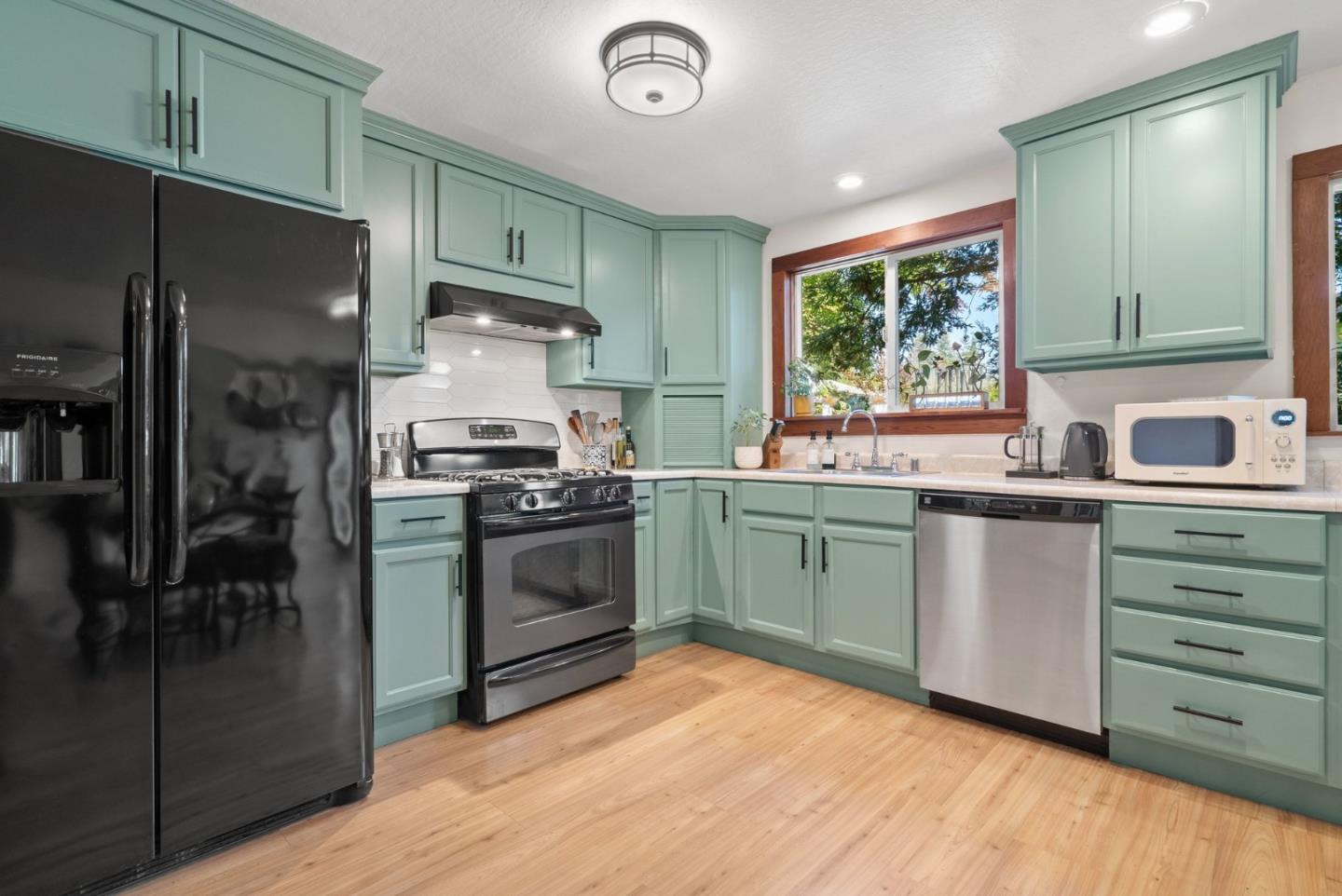280 Main Street Ben Lomond, CA 95005 - Photo 15 of 47 a kitchen with a sink stove and refrigerator
