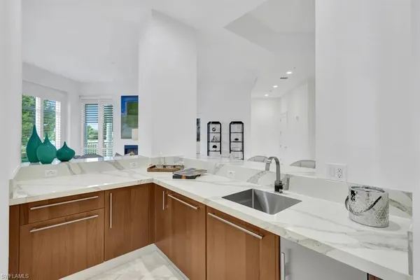 a kitchen with a sink and cabinets