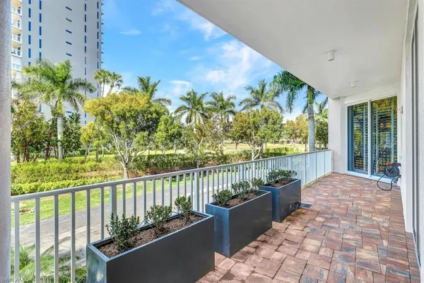 a balcony with wooden floor