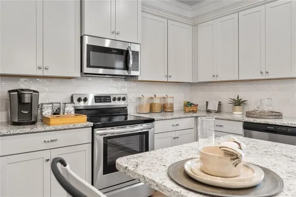 a bathroom with a granite countertop sink and mirror