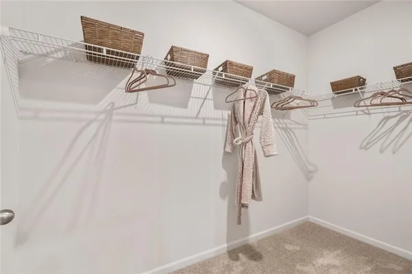 a white bath tub sitting in a bathroom next to a white sink